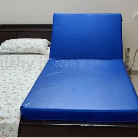 Recliner bed backrest raised to upright sitting position
