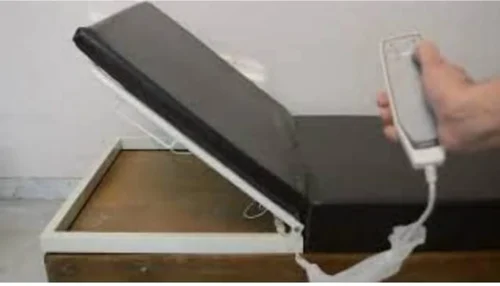 Technician installing recliner bed at home